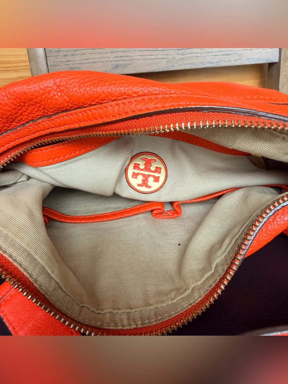 Tory Burch Amalie Adjustable-Strap Hobo features soft leather and signature gold